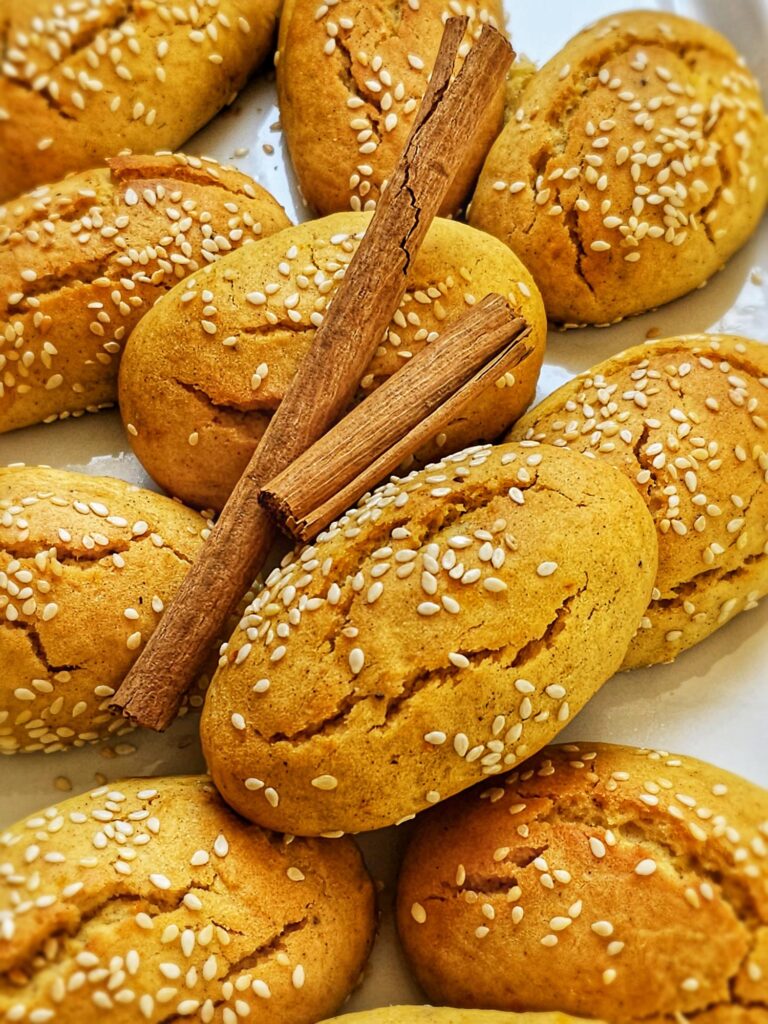 greek olive oil cookies sprinkled with sesame seeds and cinnamon
